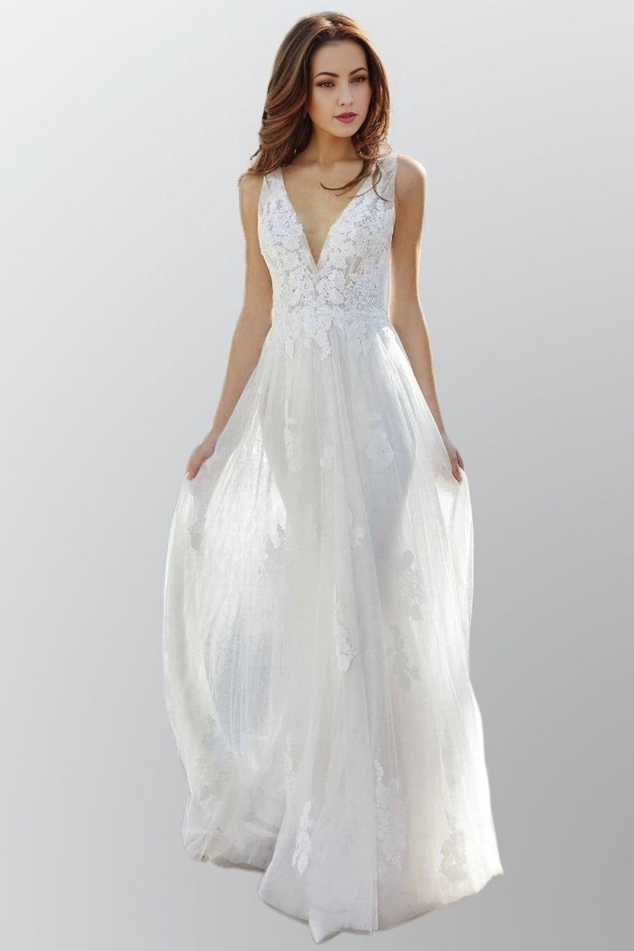 Bride wearing the LISA Wedding Dress with floral lace bodice and flowing skirt.