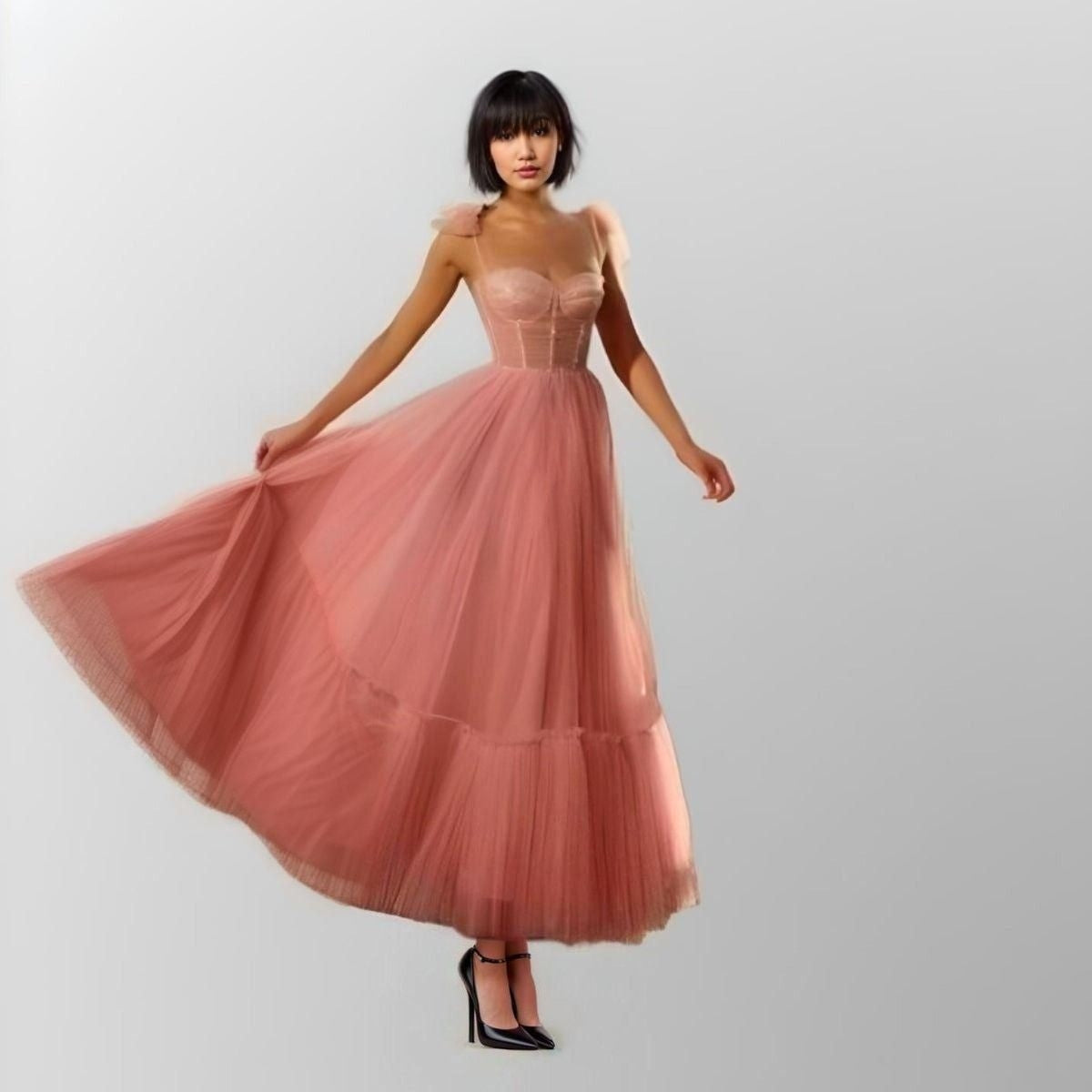 Model in the LITZY pink beaded tulle gown with sweetheart neckline.