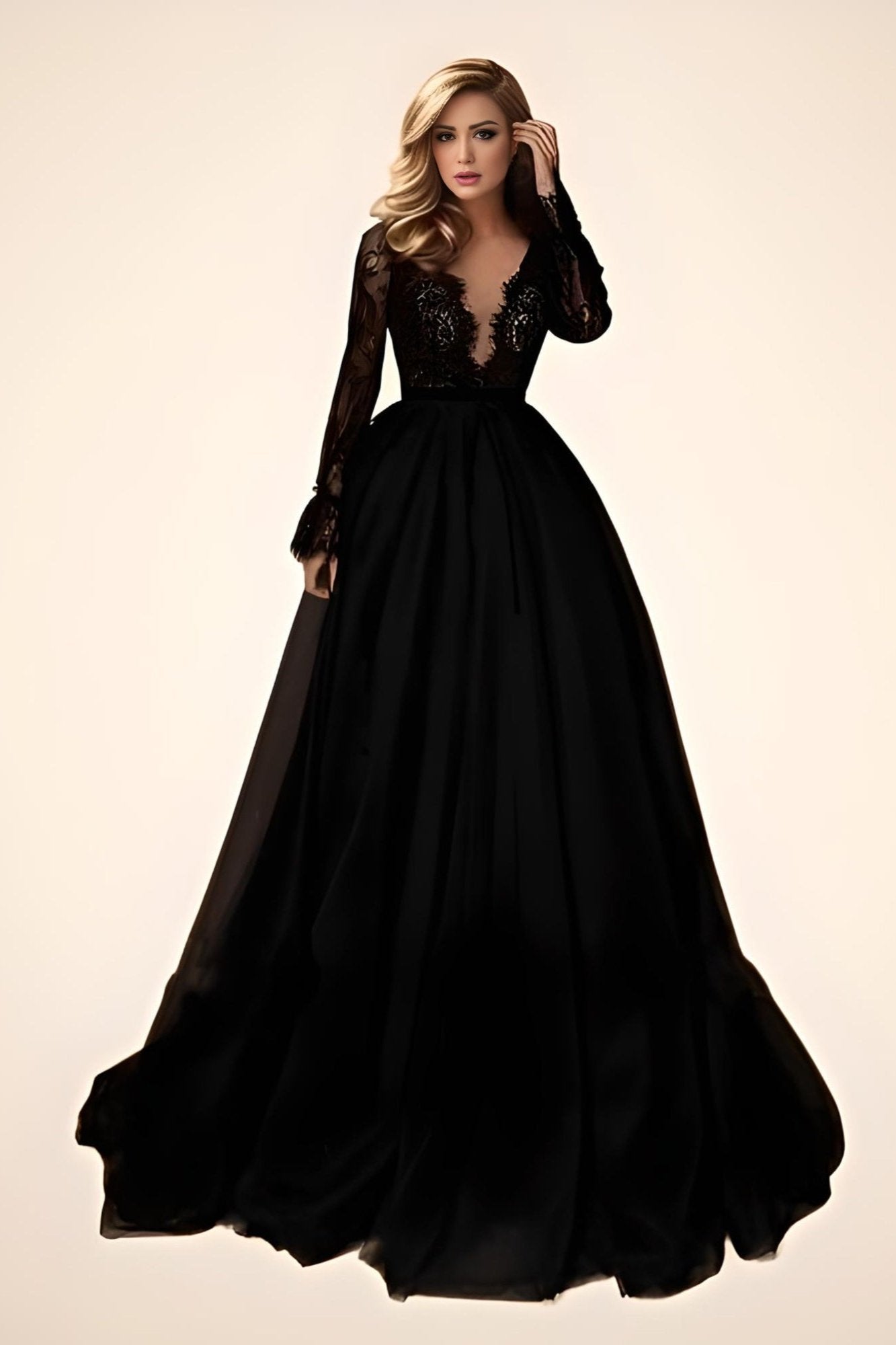 Model showcasing Elegant Black Formal Dress with the plunging V-neck and illusion lace bodice.
