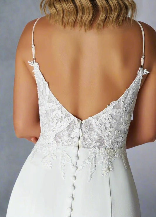 Elegant cut-out V back detail on lace bodice wedding gown with spaghetti straps