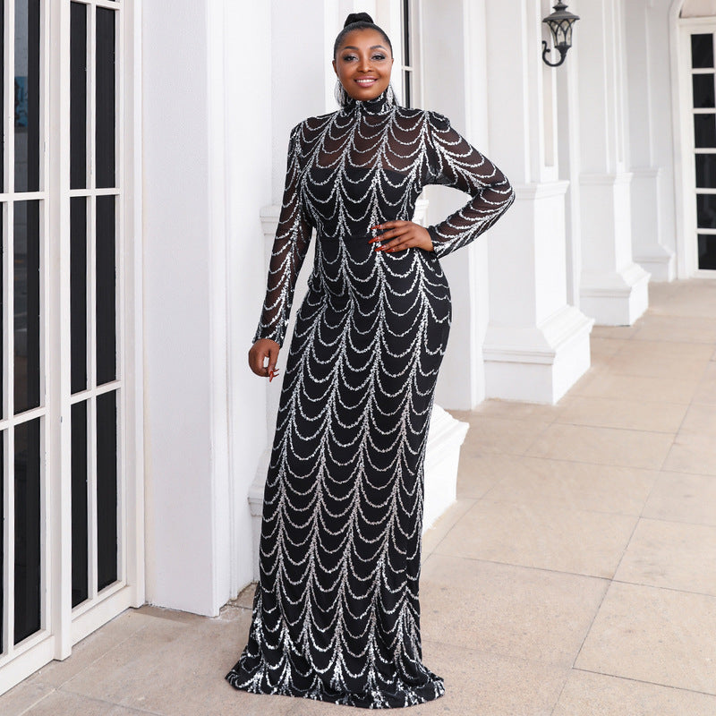 Woman wearing PAOLA PLUS formal dress with silver sequined black fabric