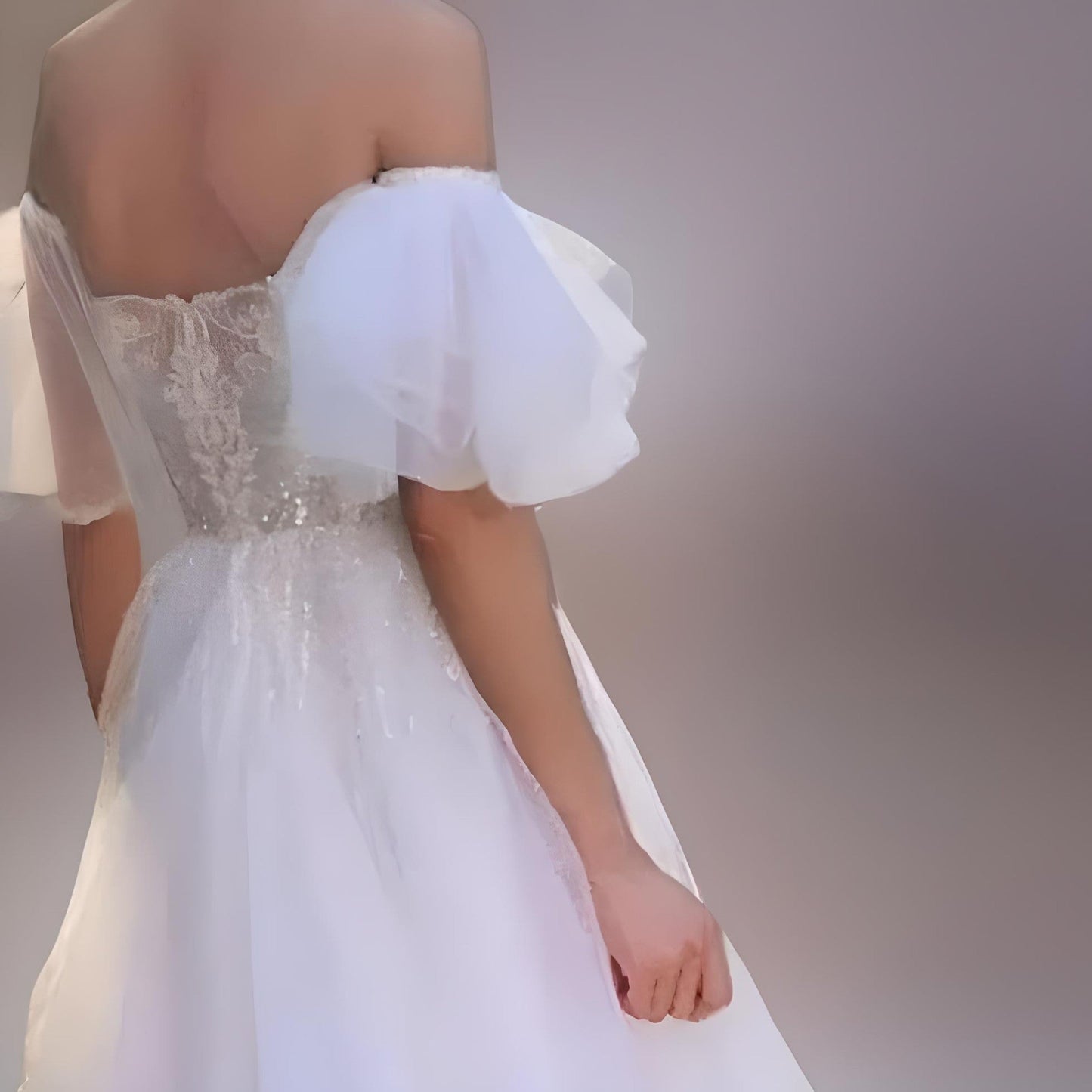 Off-the-shoulder bridal dress with removable ruffled sleeves