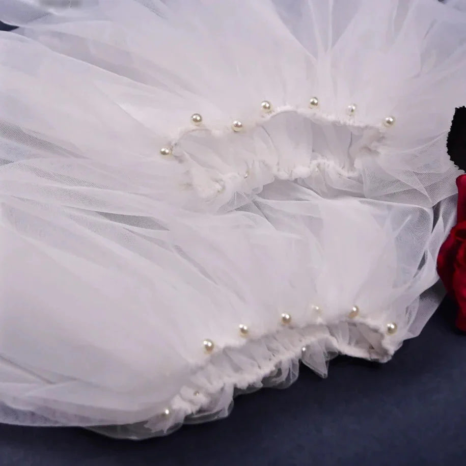 Close-up of fabric details on bridal detachable sleeves with pearls