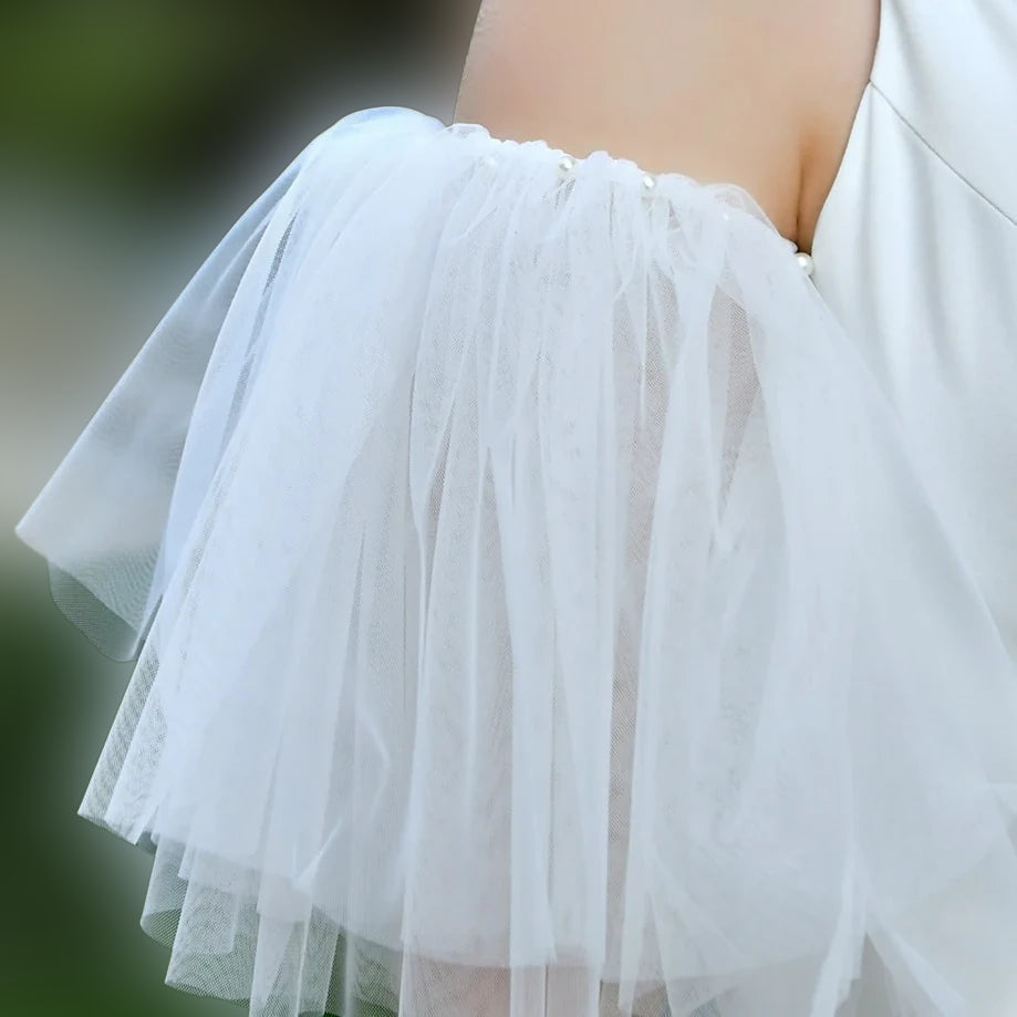 Delicate sheer wedding sleeves as a bridal accessory