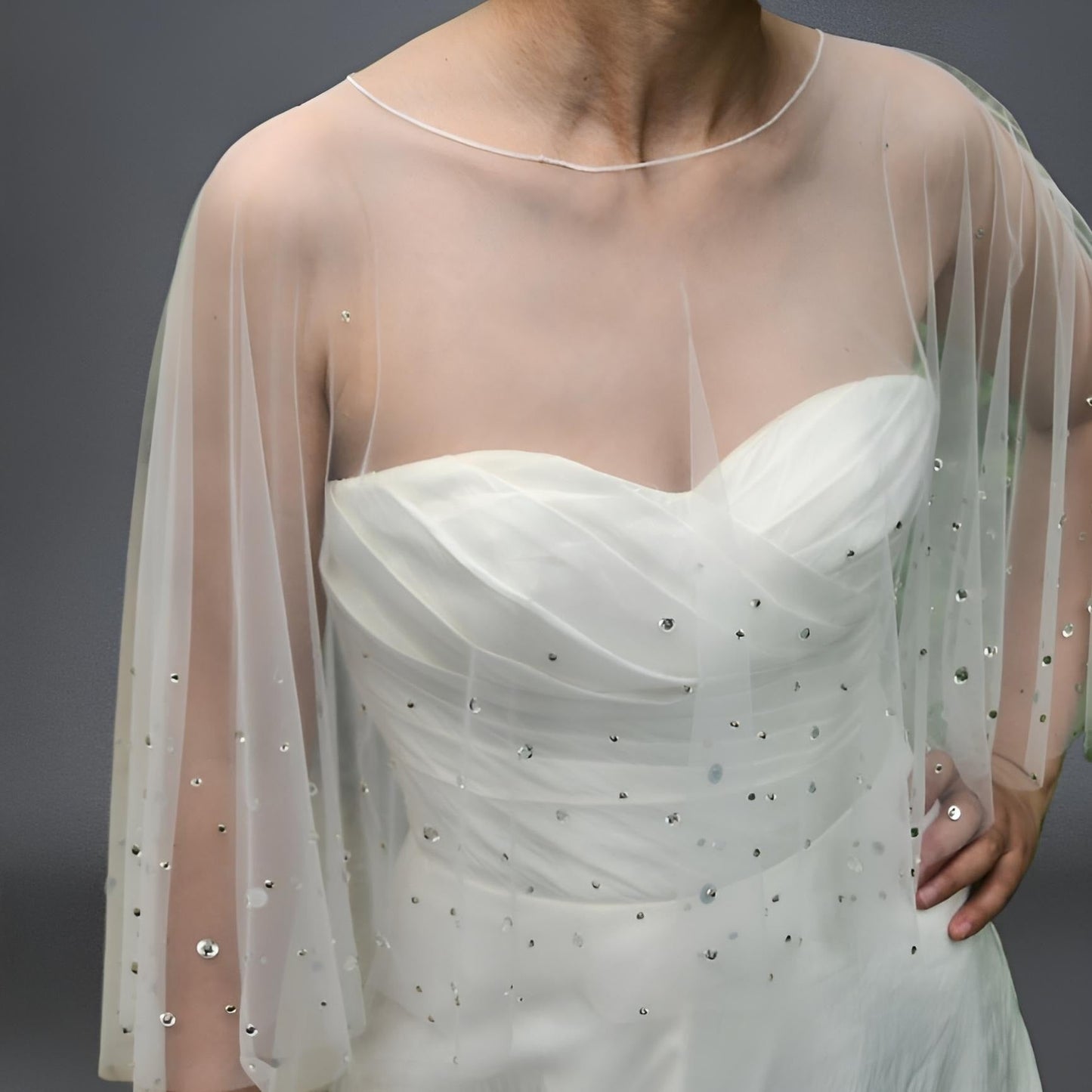 Close-up of beaded wedding shawl with sparkling rhinestones.