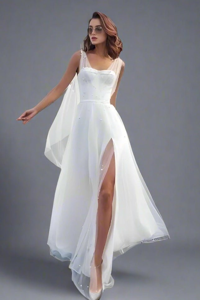 Bride revealing high slit detail of SADIE A-line wedding dress.