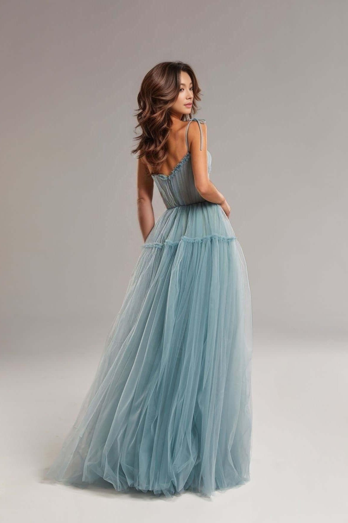 Back view showing the zipper closure of the dusty blue SARKA tulle pleated formal dress.