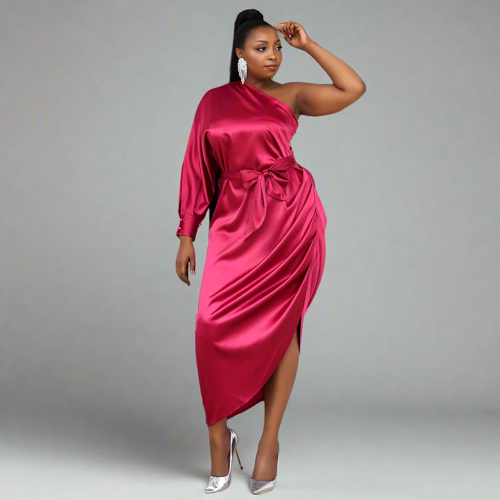 Full-length shot of the woman in magenta SASKIA tea-length formal dress in satin fabric.