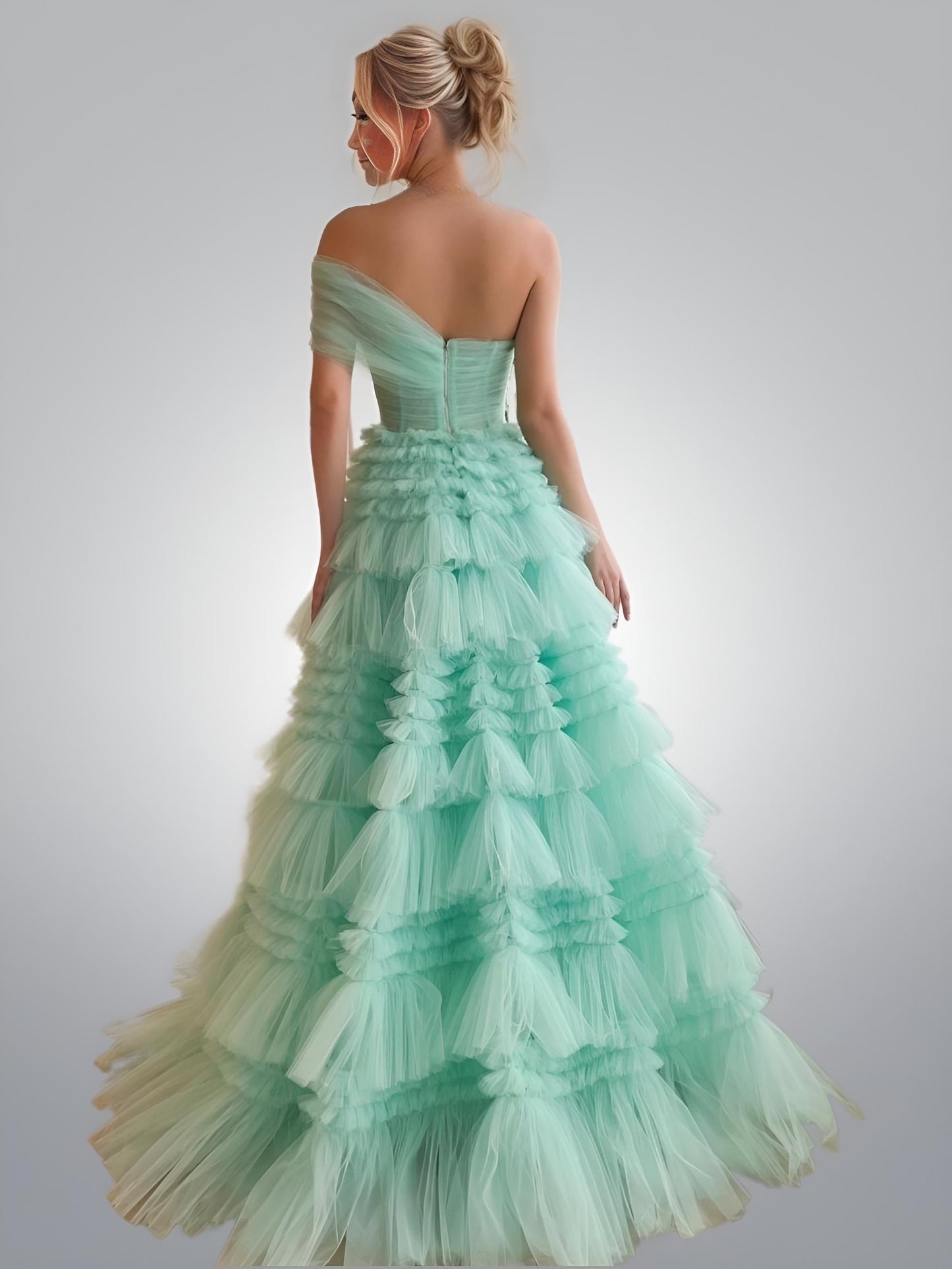 Back view of the Scarlett Mint Green Prom Dress showing its graceful cut and one sided off the shoulder design.