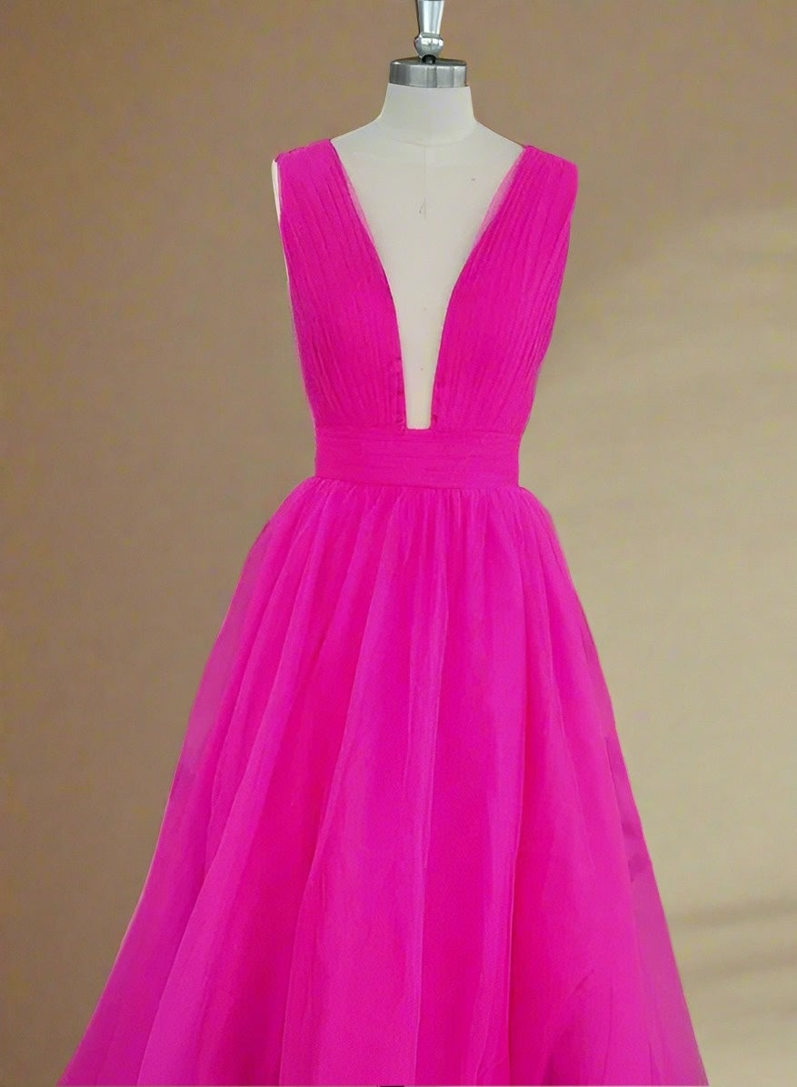 Detailed shot of the bodice on manequin, highlighting the plunging neckline and pleated texture.