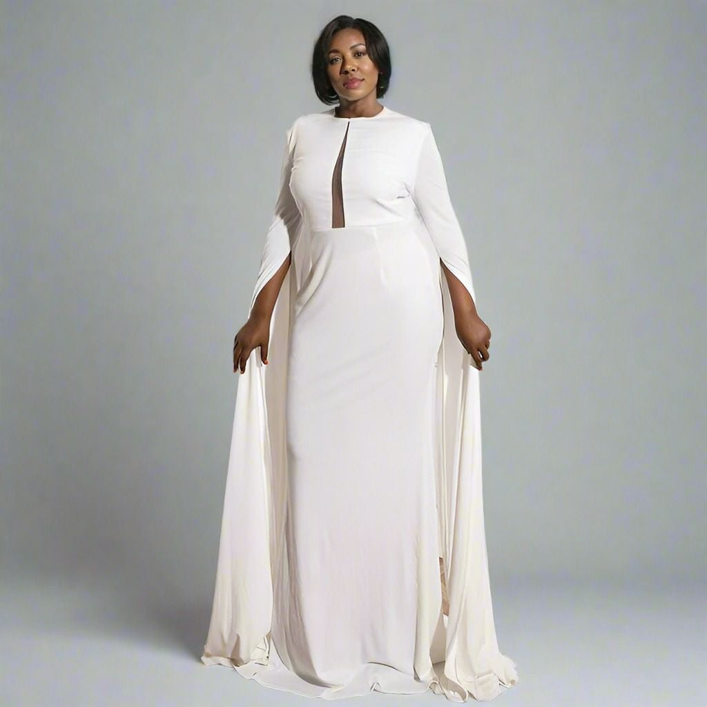Mature woman in the Sonya Formal Dress with a sweep cape sleeves details.