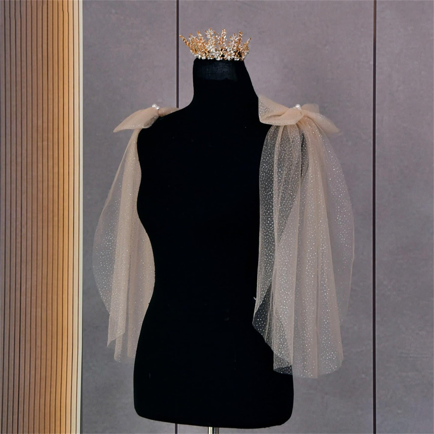 Close-up of the handmade champagne colored Glitter Sparkling Bridal Wings Veil