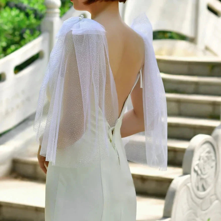 Model showcasing the shimmering effect of the Glitter Sparkling Bridal Wings Veil.