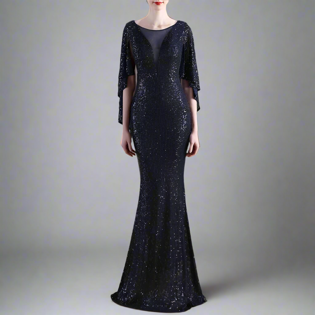 Woman wearing a navy sequin evening gown with a blurred background