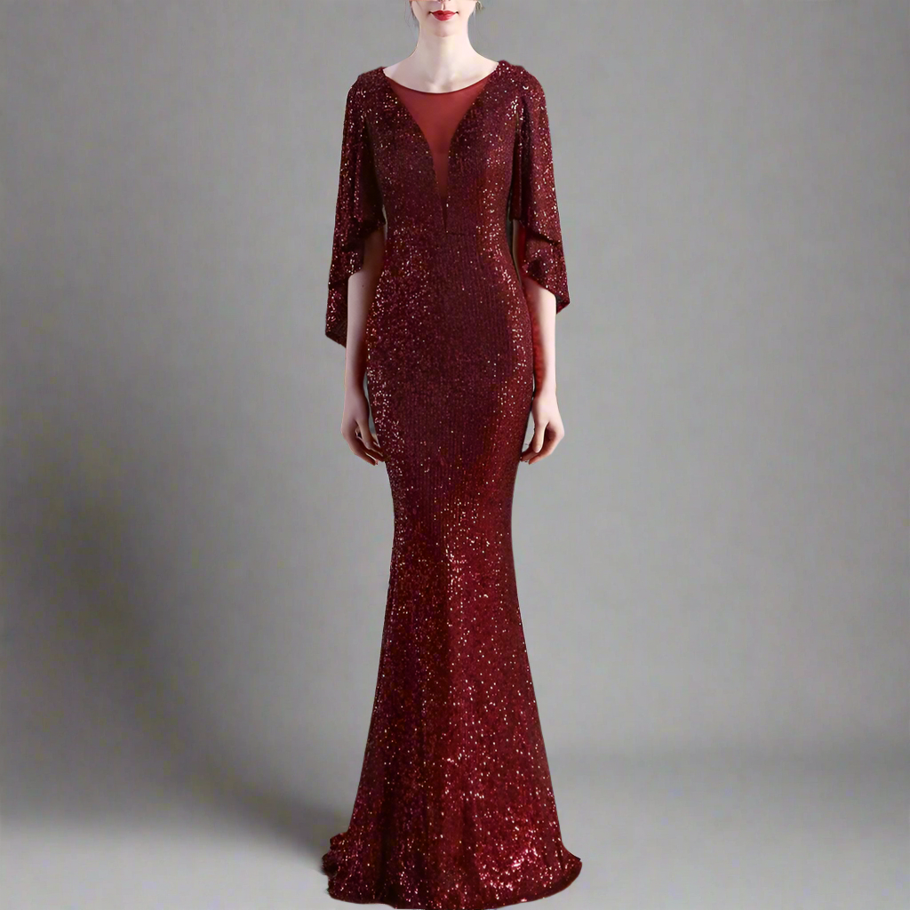 Woman wearing long formal burgundy sequin dress.