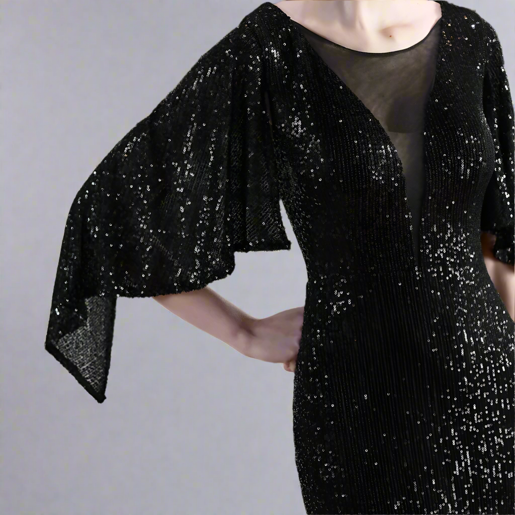 Black sequin dress with a blurred background