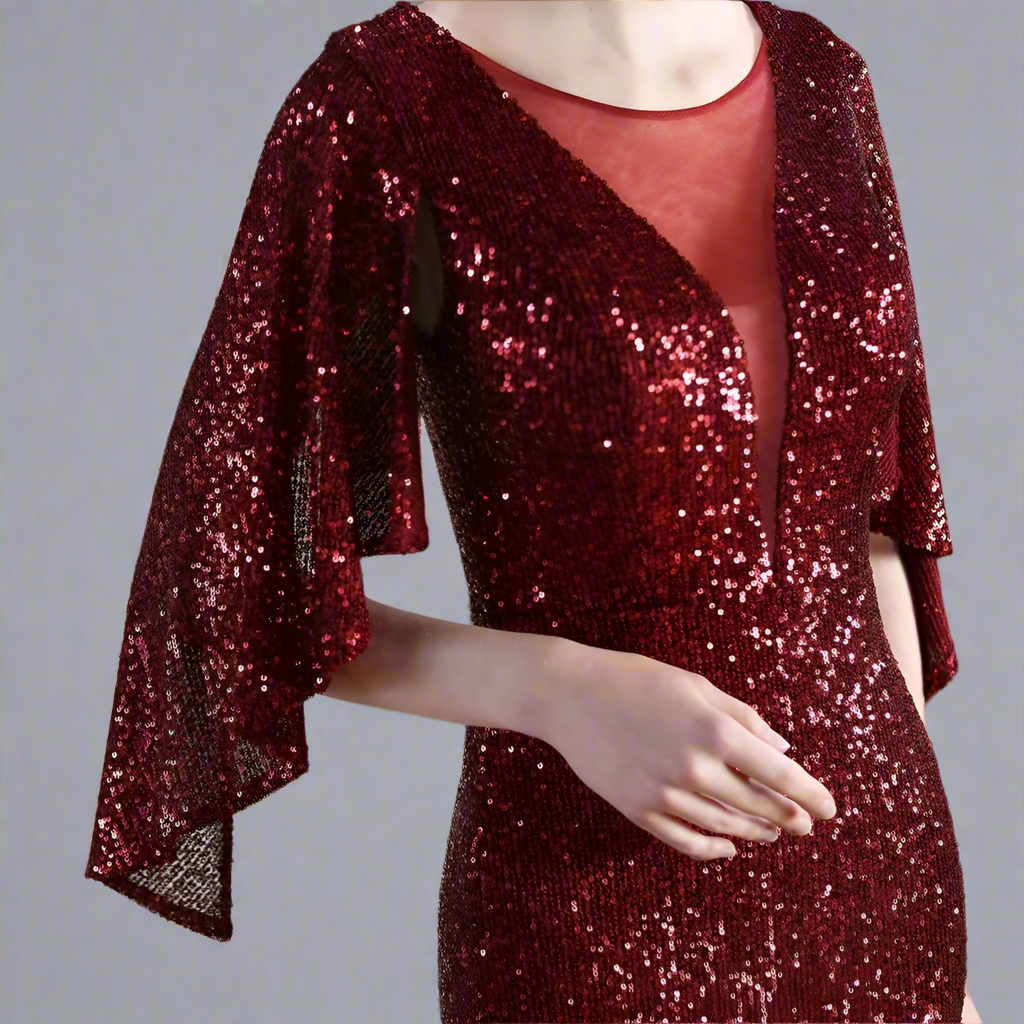 Close up of woman wearing a burgundy sequin dress.
