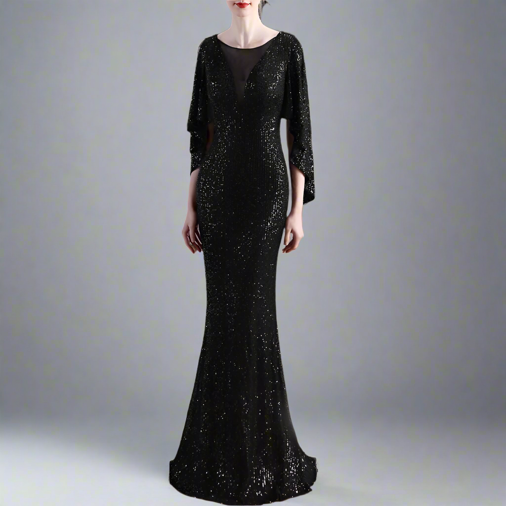 Woman wearing a black sequin evening gown with a blurred background