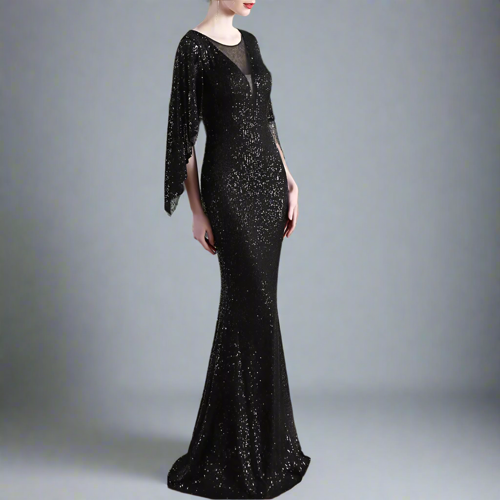 Black sequin evening gown with long sleeves in an studio setting