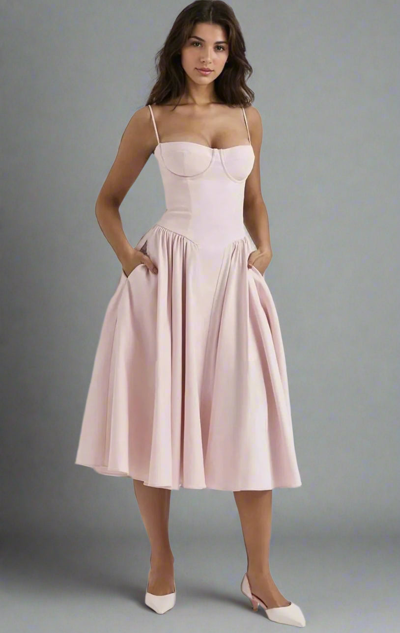 Brunette in tea-length light baby pink dress for cocktail, formal or party events.