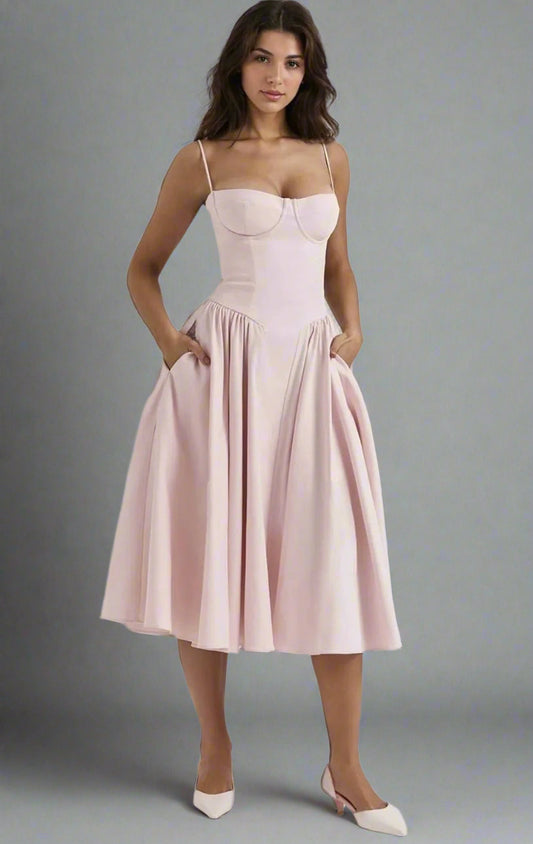Brunette in tea-length light baby pink dress for cocktail, formal or party events.