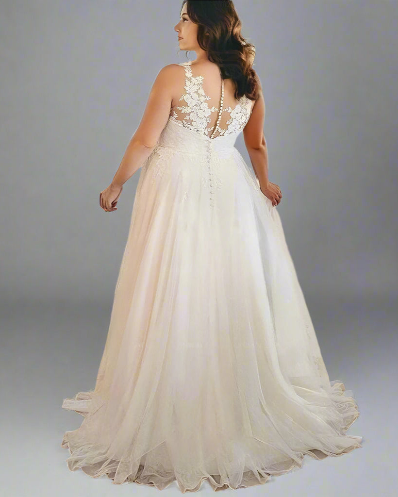 Bride wearing the Valencia Wedding Dress and showcasing back lace design.