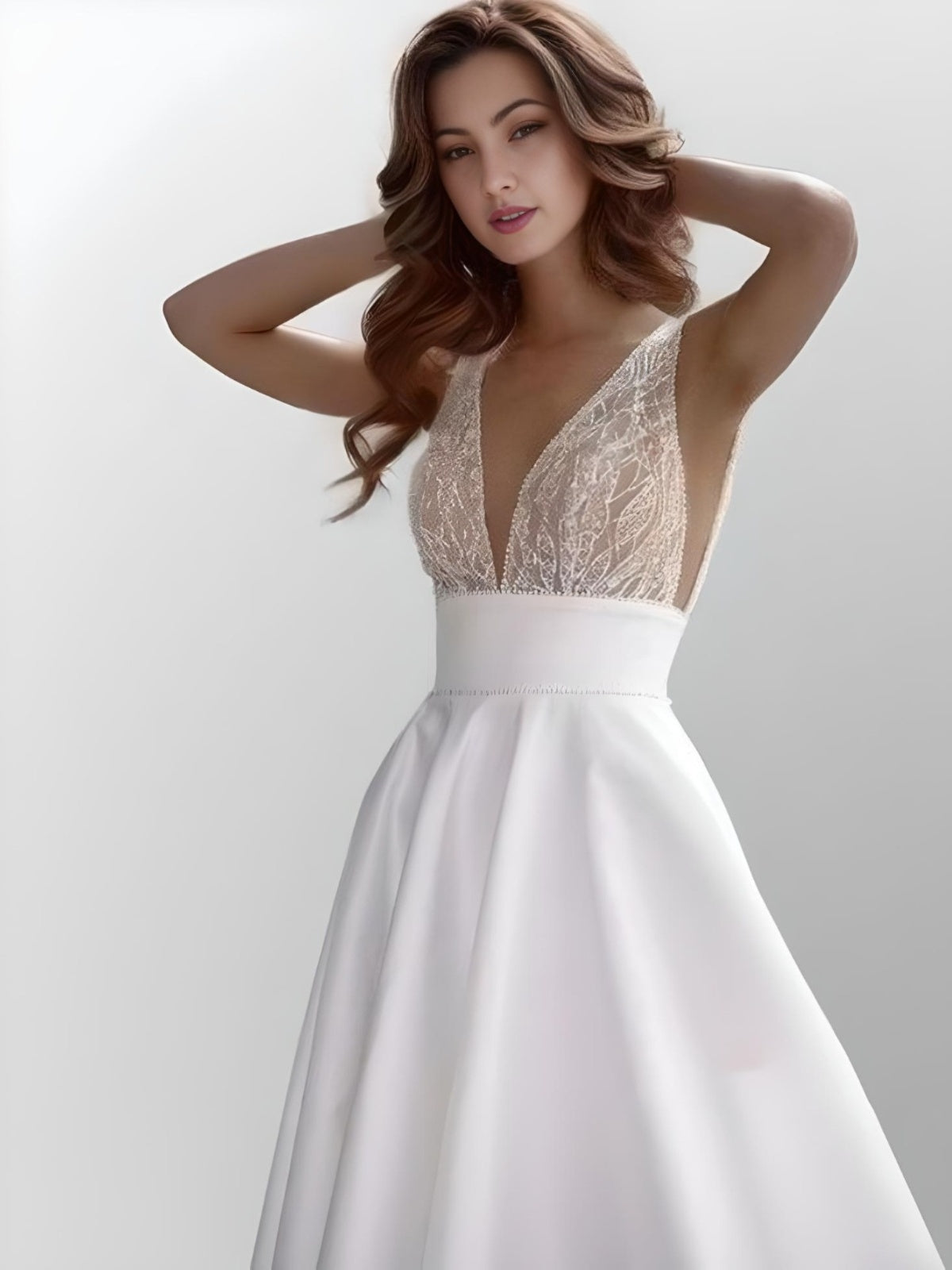 Front view of woman in shimmering LUZ Bridal Gown with satin and tulle details