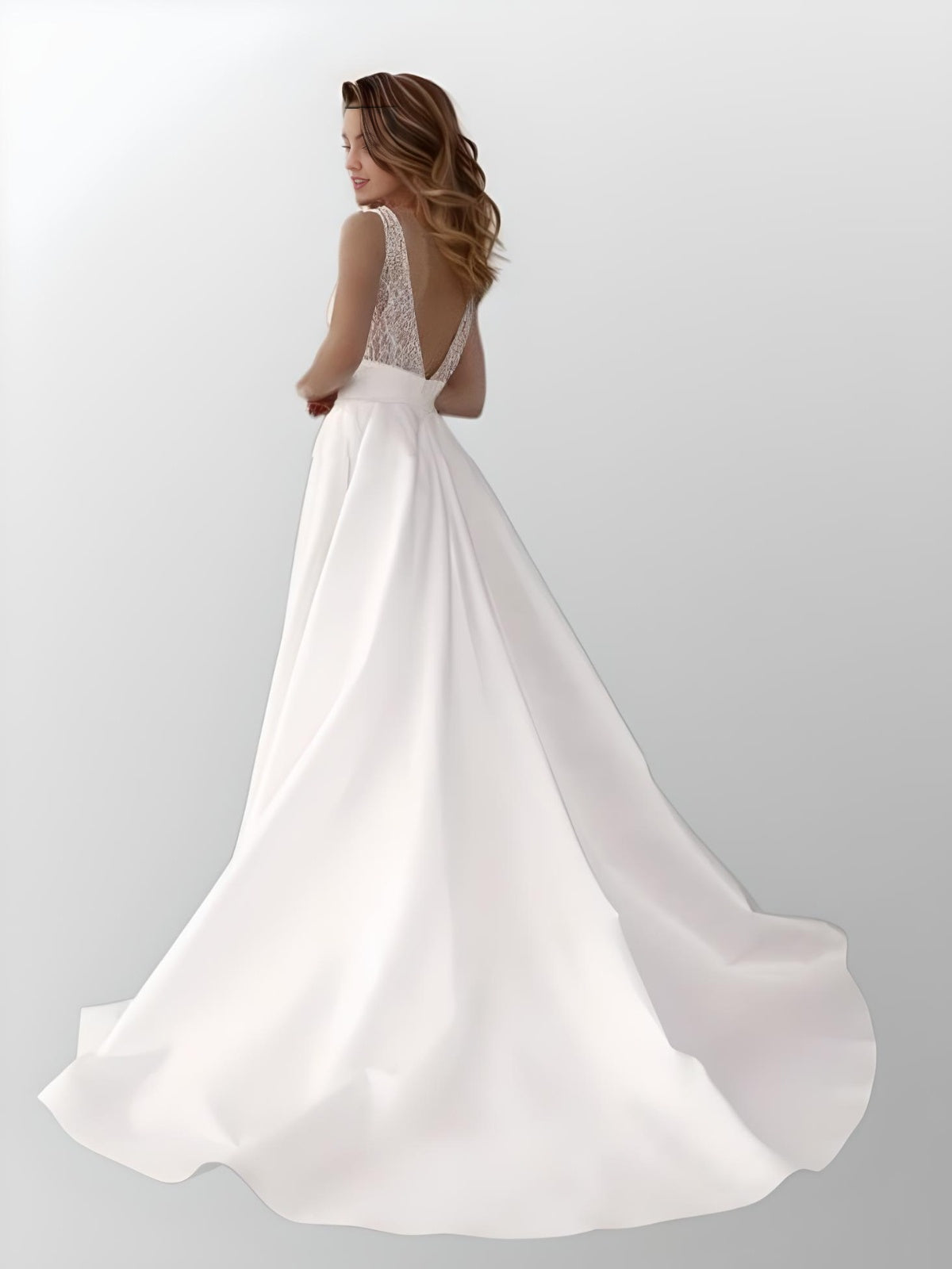 Woman wering backless V-back design of LUZ Wedding Dress