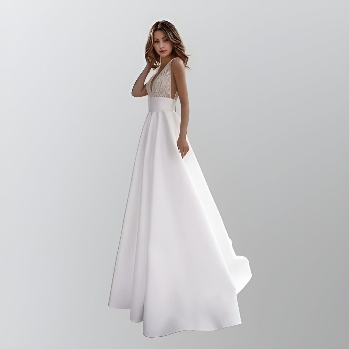 Bride wearing LUZ Wedding Dress with glittered tulle V-neck bodice and satin A-line skirt.