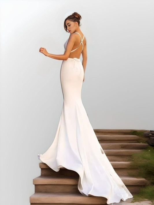Backless design of LYNETTE Wedding Gown with sweep brush train.