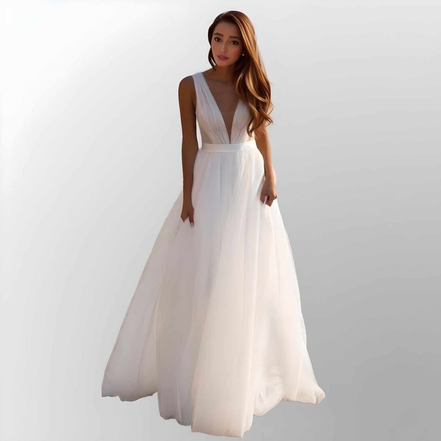 Bride showing the V-neckline and pleated tulle of the Lynley Wedding Dress
