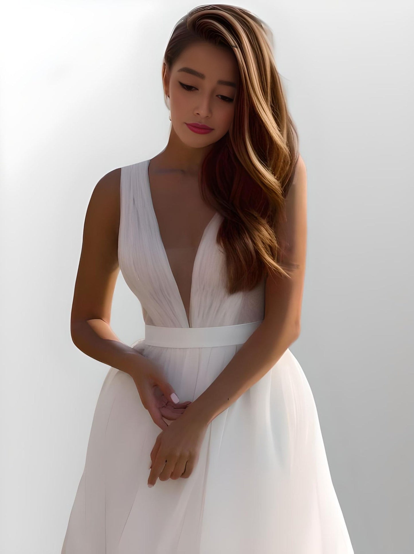 Bride wearing the Lynley gown on the, highlighting the pleated tulle detail on bodice.