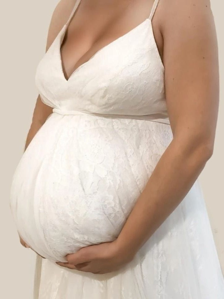 Detail View of Lace Detailing on Pregnant Bride's Wedding Dress