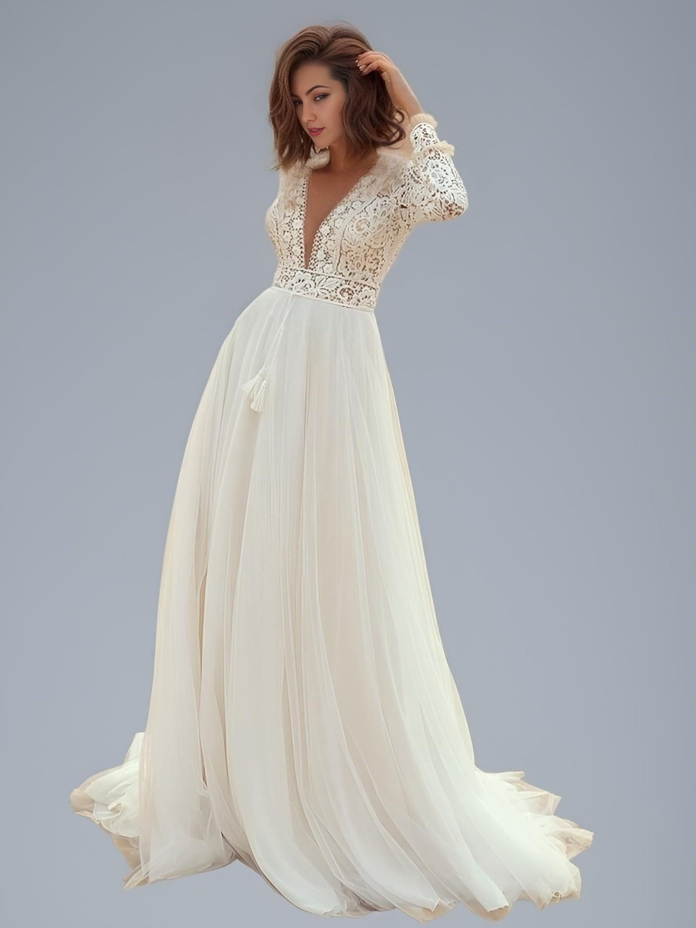 Bride posing in flowing lace and tulle boho Wedding Dress
