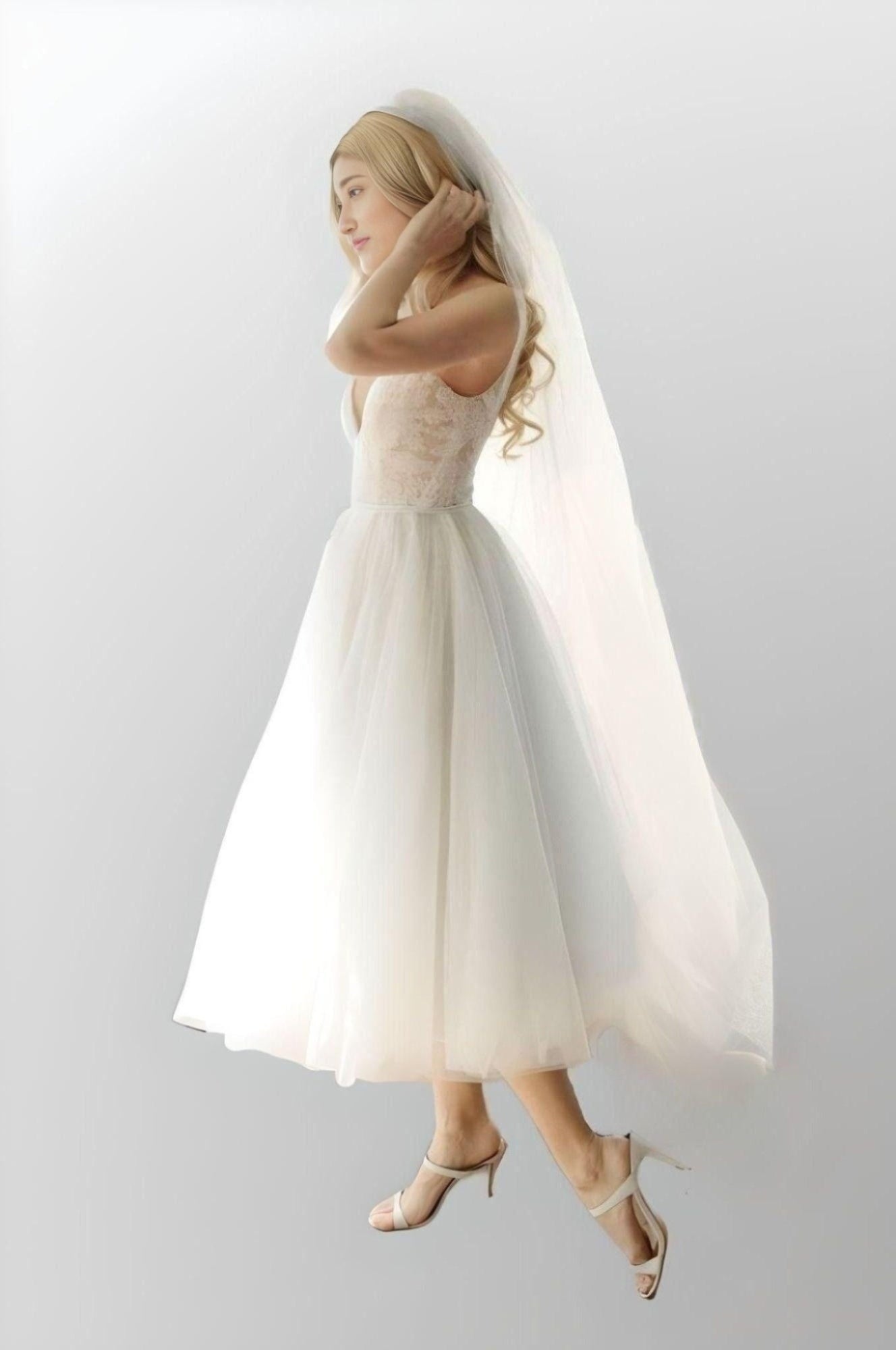 Side view of MATTIE knee-length bridal gown with spaghetti straps
