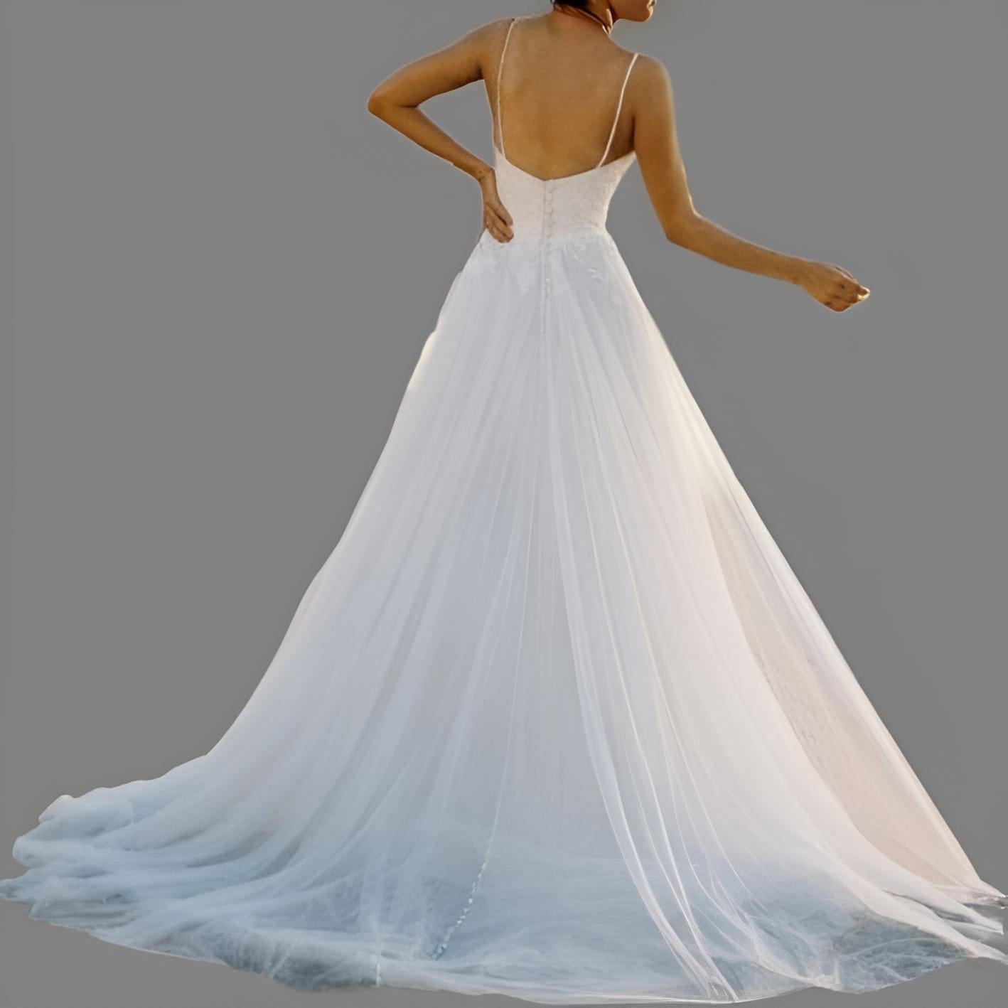 Elegant bride from back posing in MAYRA lace and organza wedding dress