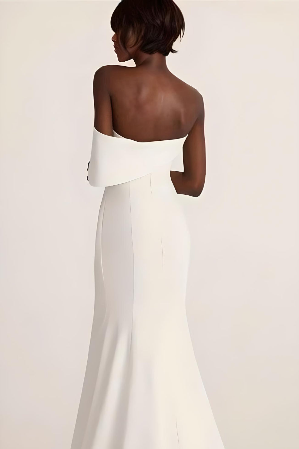 Close-up of luxurious stretch satin fabric on MEGHAN gown