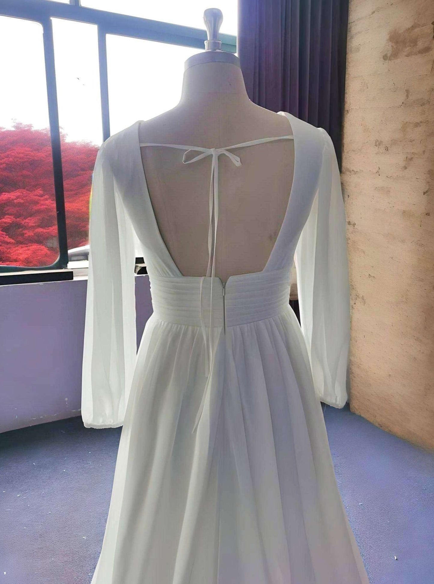 Detail of Tie-up Closure on Open Back of Simple Wedding Dress