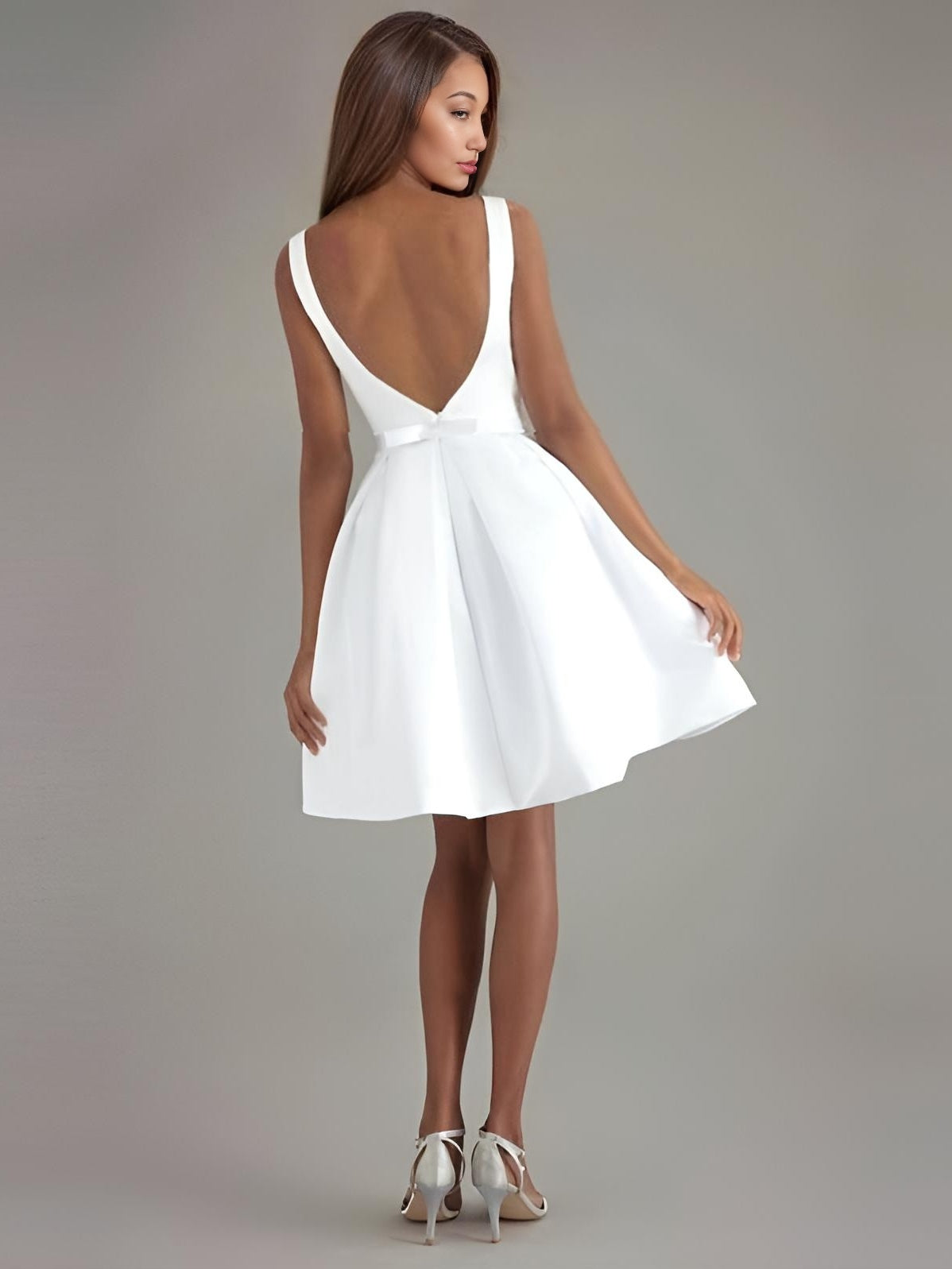 Back view of MICAH bridal gown showcasing deep V-back and bow