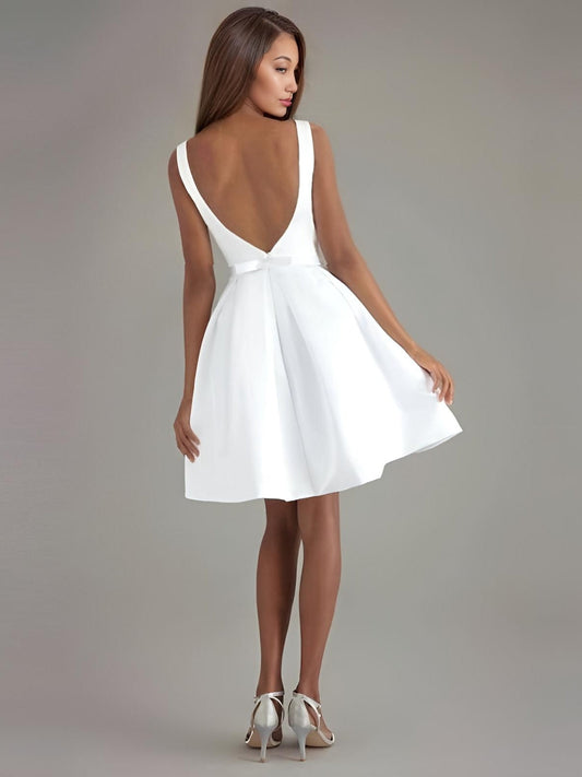 Back view of MICAH bridal gown showcasing deep V-back and bow