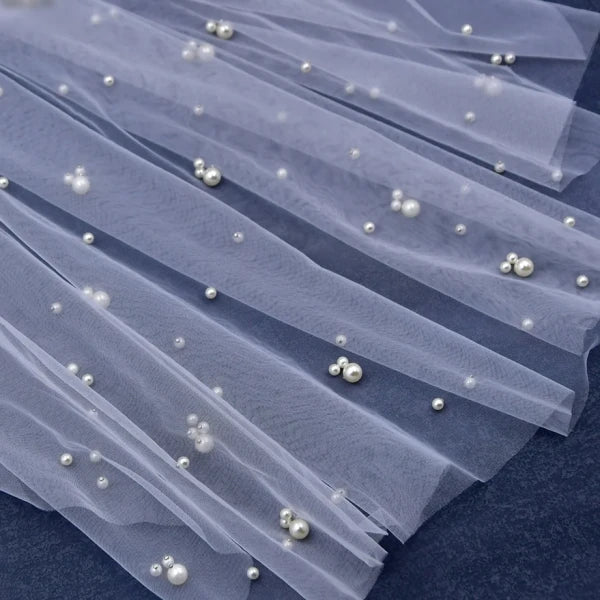 Close-up of scattered pearl details on Milky Way Bridal Veil
