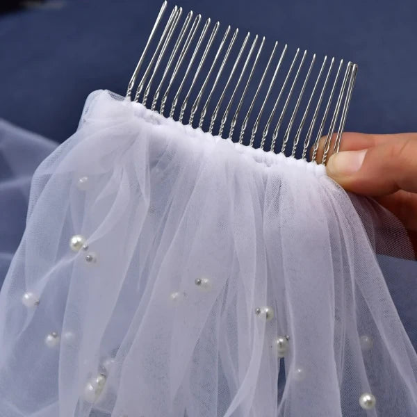 Close-up of hair comb on Milky Way Bridal Veil with scattered pearls