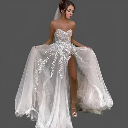 Bride wearing MINA Wedding Dress with sweetheart neckline and floral leaf lace appliques