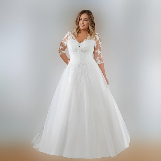 Bride wearing MORGAN Wedding Dress with illusion lace top and 3/4 sleeves