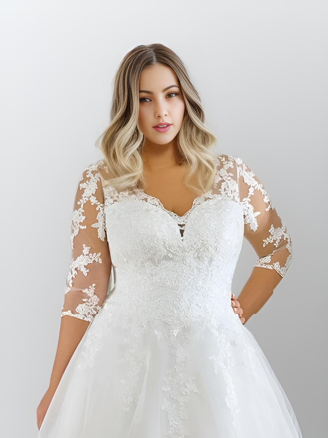 Close-up of lace appliques and illusion lace sleeves on MORGAN Wedding Gown