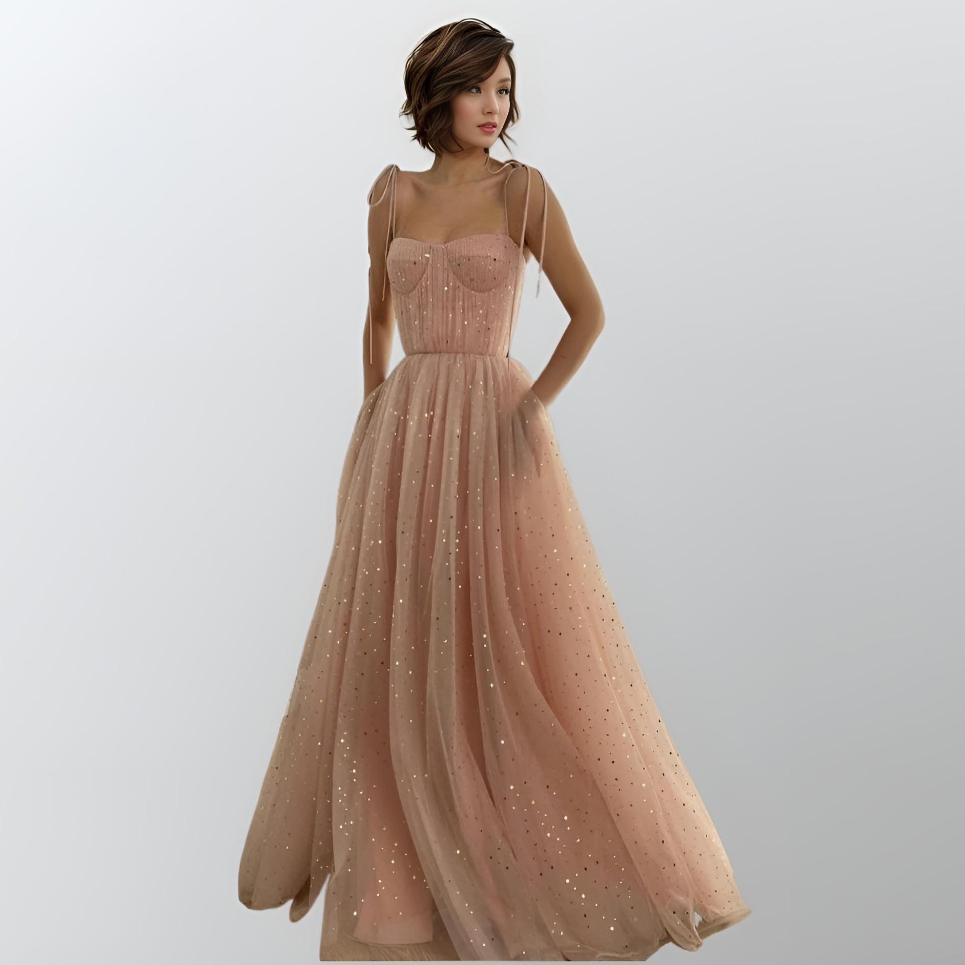 Woman wearing MYLEE Formal Dress in baby pink color with starry tulle