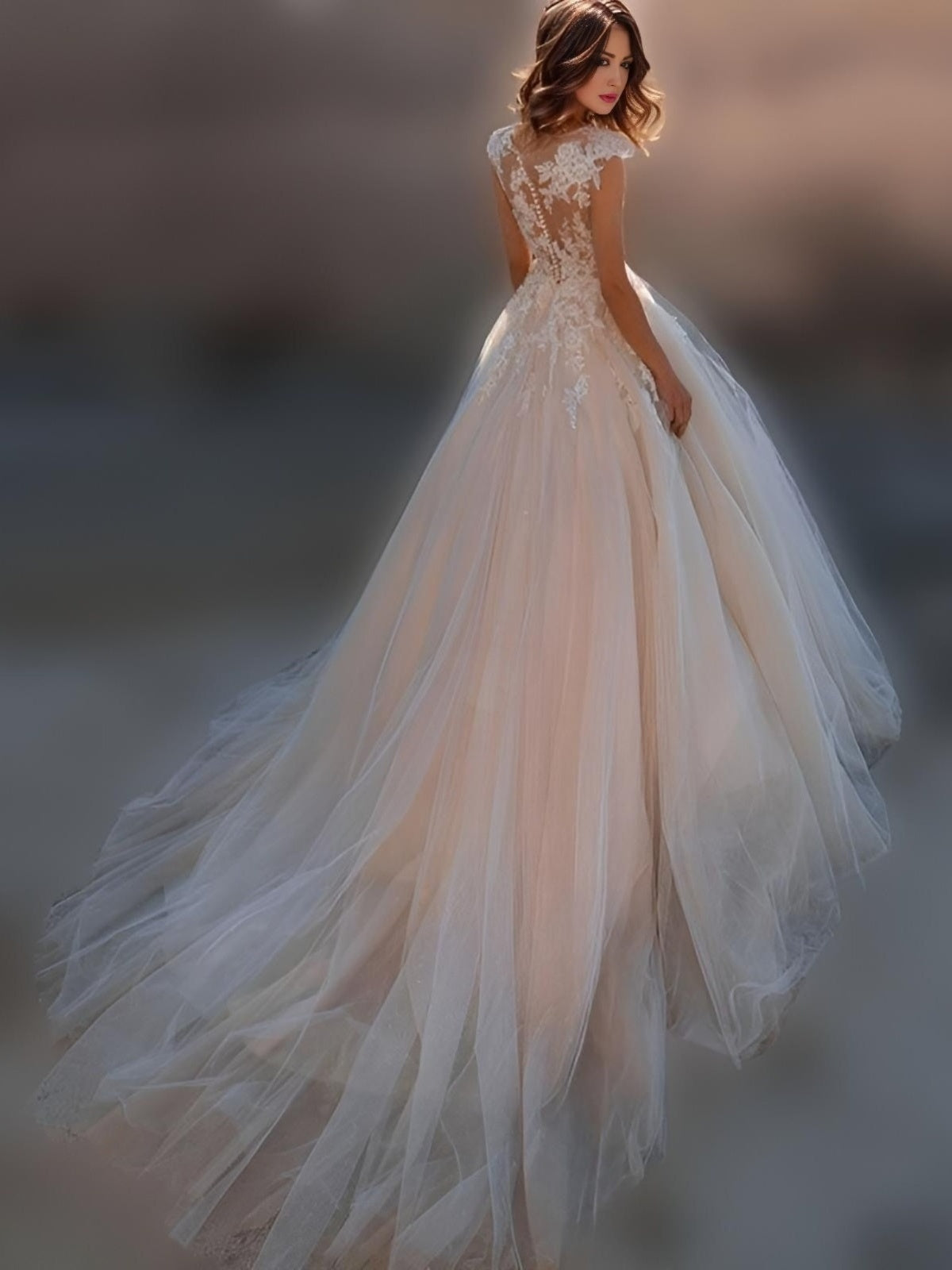 Back view of NICOLA Wedding Dress showcasing illusion details and sweep train