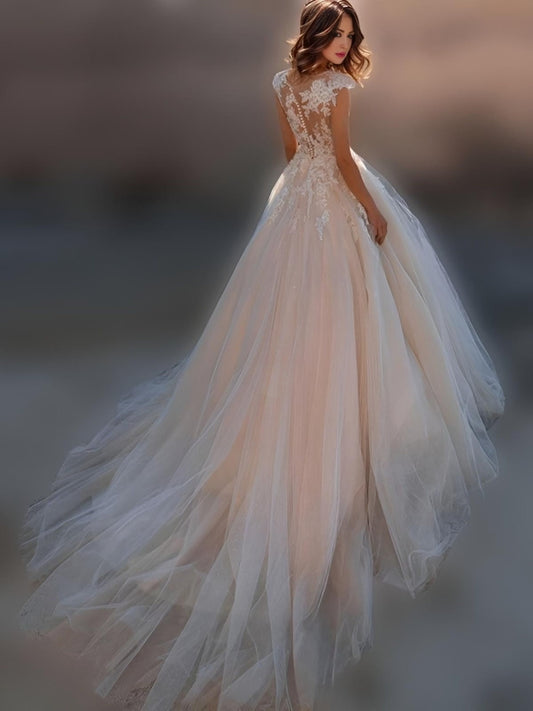 Back view of NICOLA Wedding Dress showcasing illusion details and sweep train