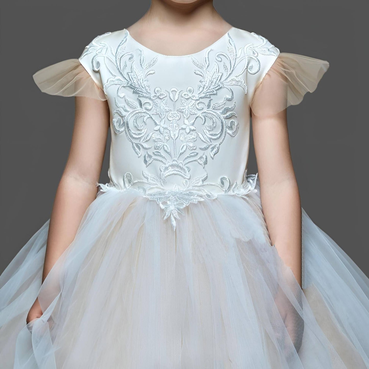 Young girl wearing NOEMI Flower Girl Dress with lace bodice and tulle skirt