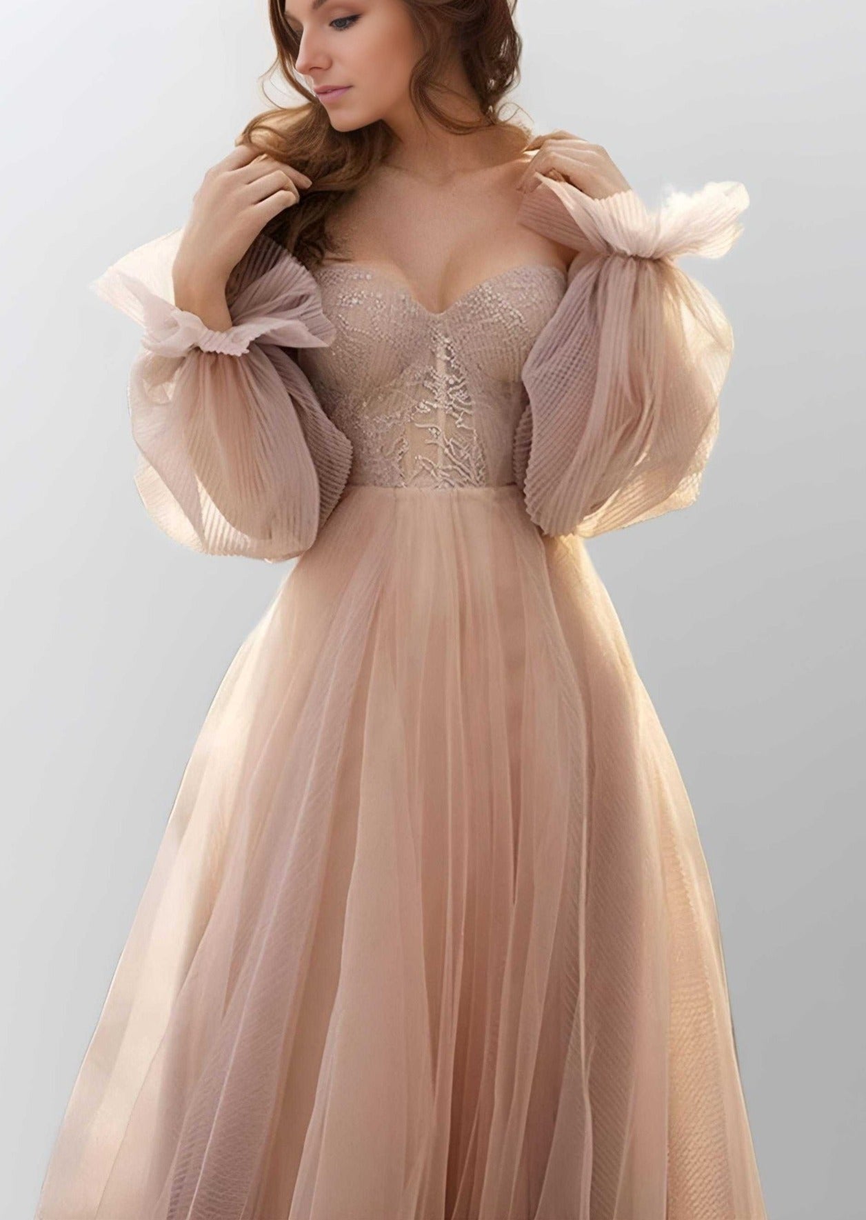 Woman posing in OLIVIA evening gown with fitted bodice